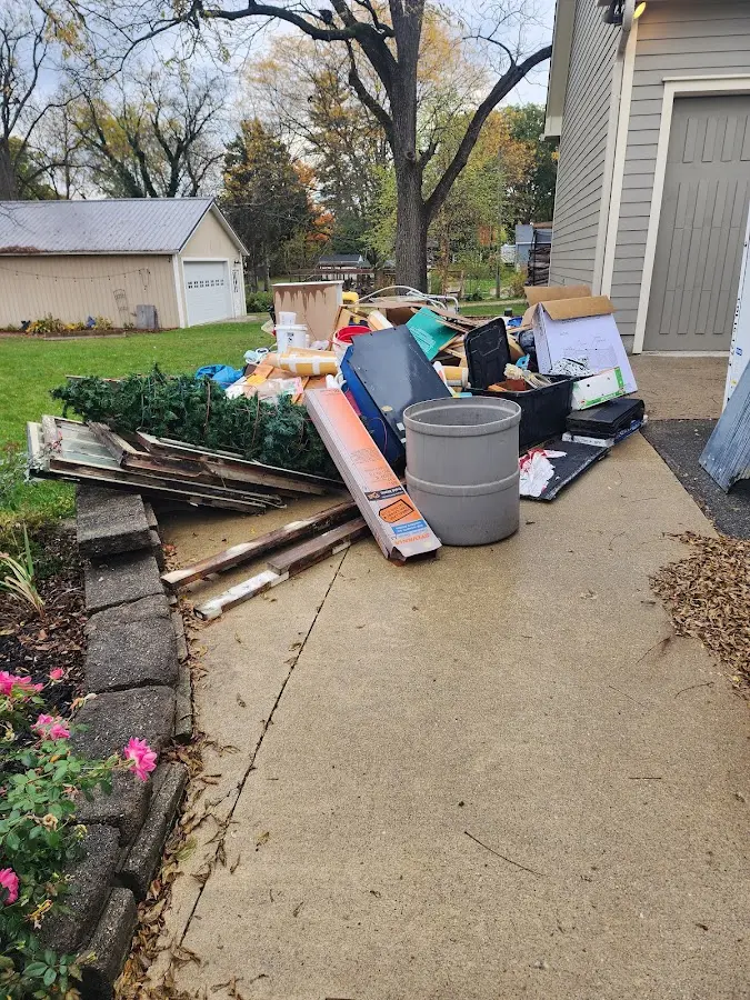 Dumpster being loaded with debris for Estate Cleanout Dumpster Rental in Villa Hills